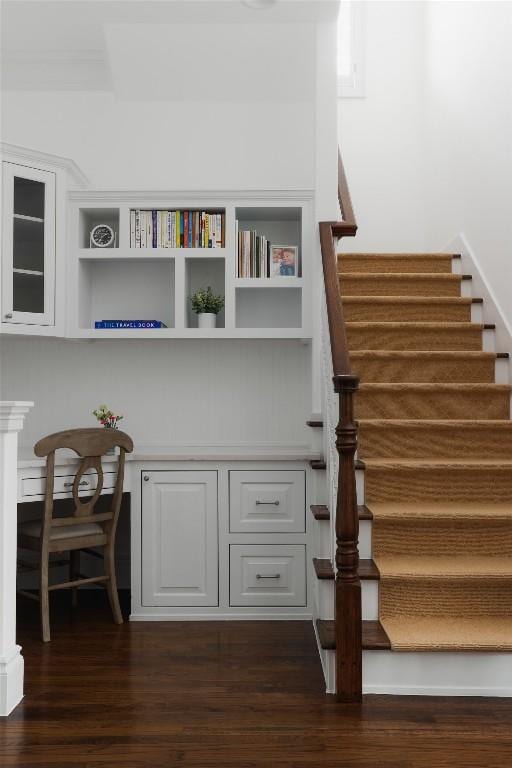 stairway featuring wood-type flooring