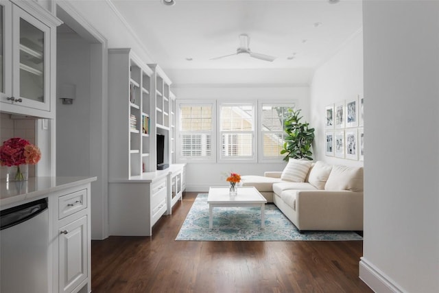 living room with dark wood-type flooring and ceiling fan