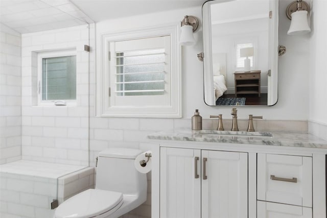 bathroom featuring vanity and toilet