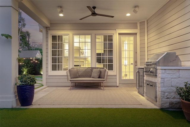 view of patio with ceiling fan, a grill, and exterior kitchen