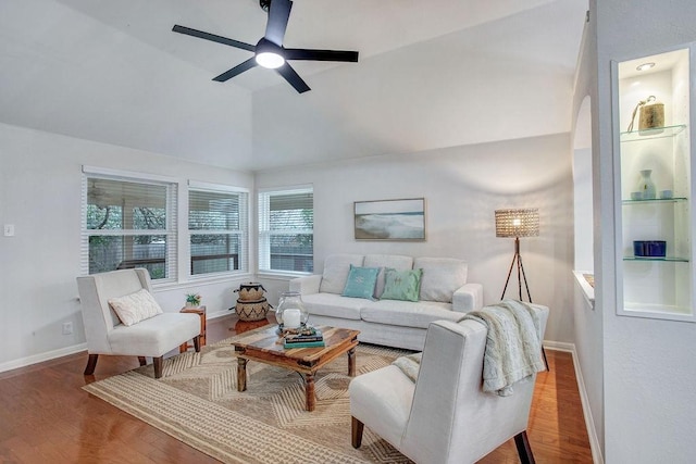 living room featuring ceiling fan, lofted ceiling, and hardwood / wood-style floors