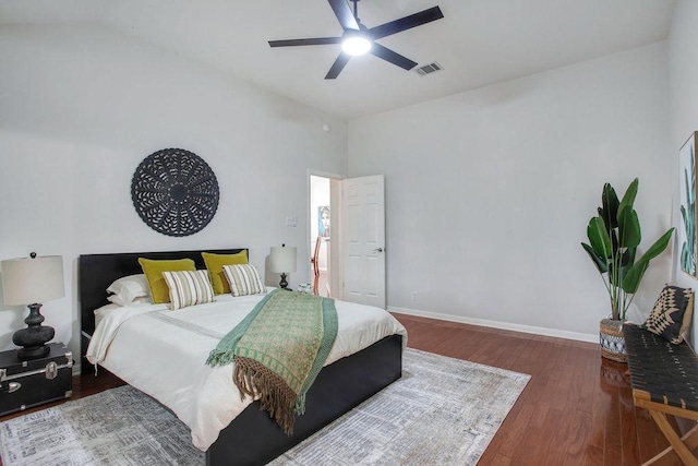 bedroom with vaulted ceiling, ceiling fan, and hardwood / wood-style floors