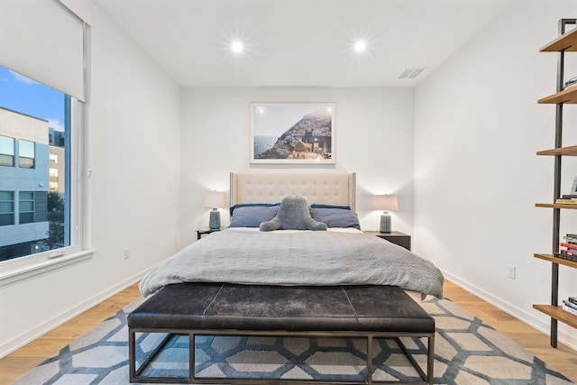 bedroom with light wood-type flooring