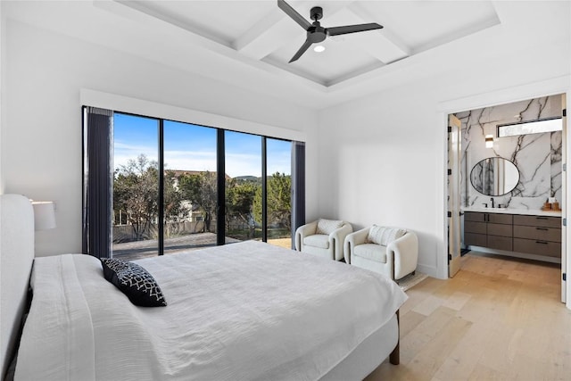 bedroom featuring connected bathroom, coffered ceiling, access to outside, beam ceiling, and light hardwood / wood-style floors