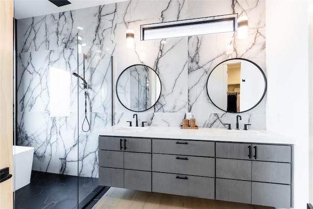 bathroom featuring vanity and a shower