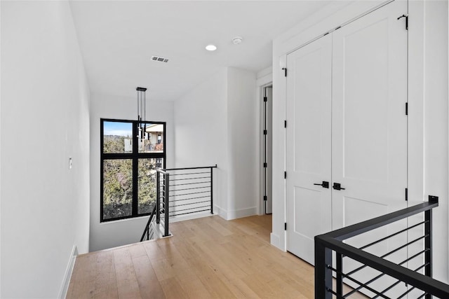 hall with light hardwood / wood-style flooring