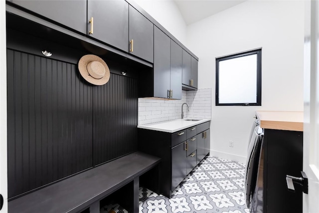 interior space featuring sink and decorative backsplash