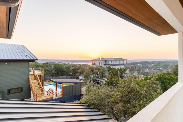 view of balcony at dusk