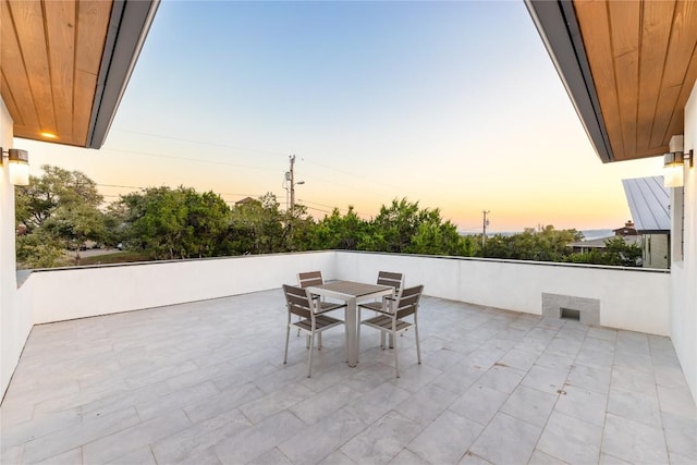 view of patio terrace at dusk