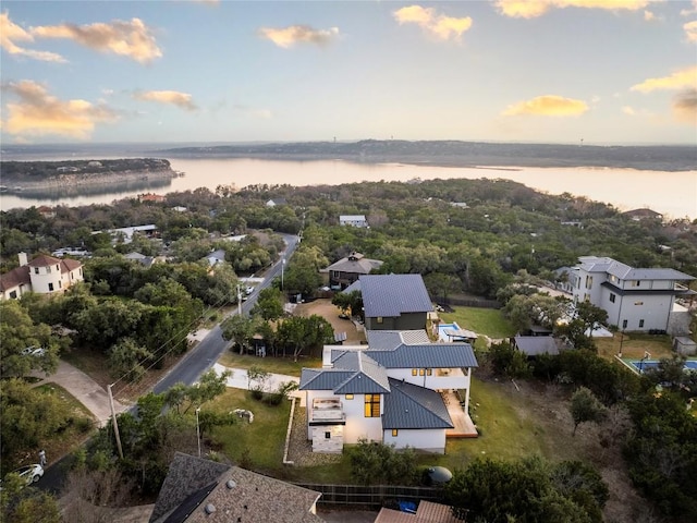 aerial view at dusk with a water view