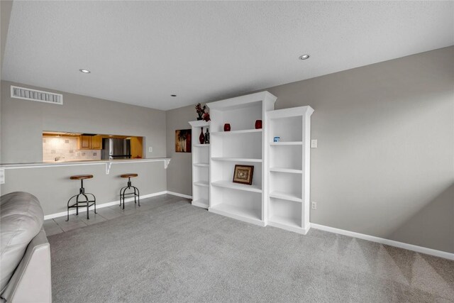 307 Poker Chip Unit 116, Horseshoe Bay, TX 78657 - living area featuring carpet and recessed lighting