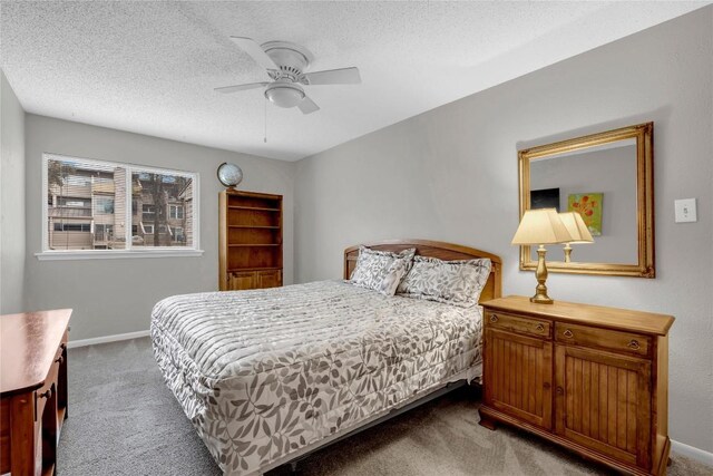 307 Poker Chip Unit 116, Horseshoe Bay, TX 78657 - carpeted bedroom with a textured ceiling and a ceiling fan