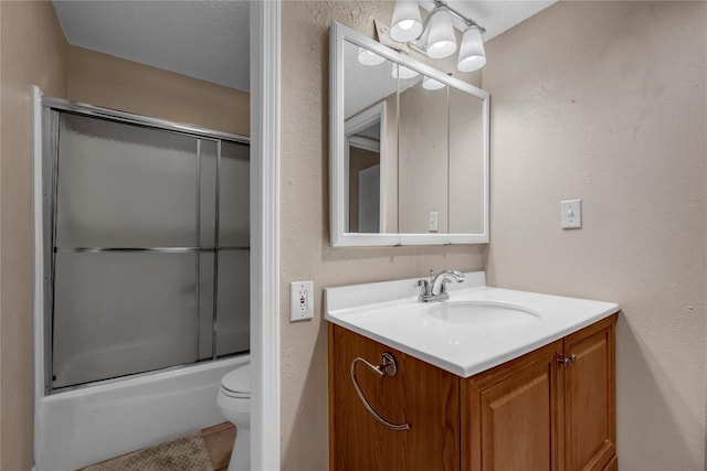 307 Poker Chip Unit 116, Horseshoe Bay, TX 78657 - full bath with vanity, shower / bath combination with glass door, tile patterned floors, and a textured wall