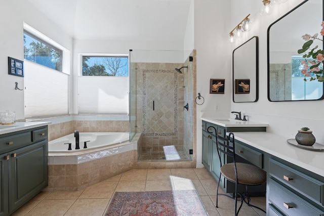 bathroom with plus walk in shower, tile patterned floors, and vanity