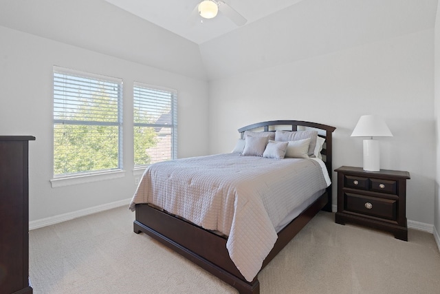 carpeted bedroom featuring lofted ceiling and ceiling fan