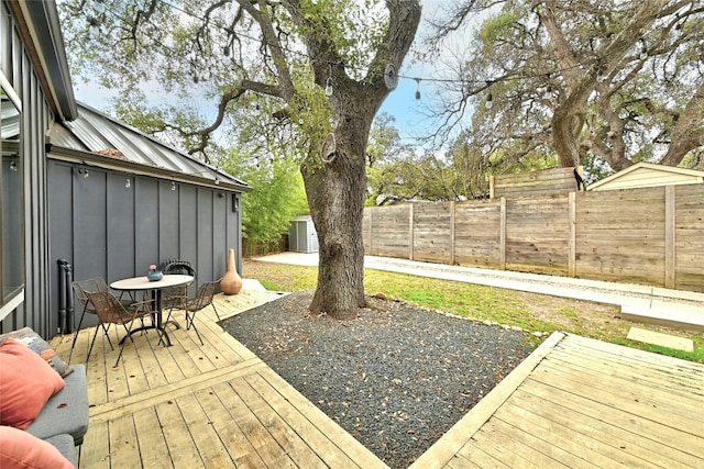 wooden terrace with a shed