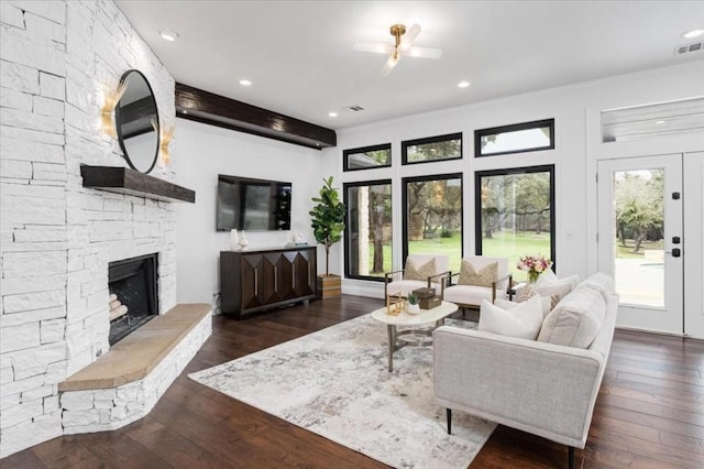 living room with a fireplace and dark hardwood / wood-style flooring