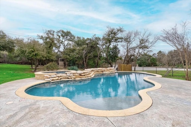 view of pool with a patio area and an in ground hot tub