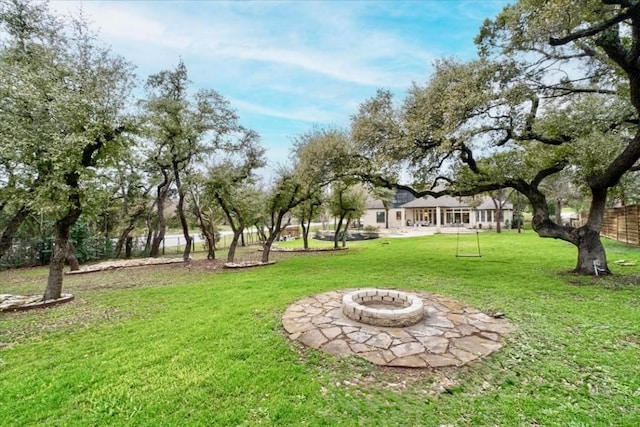 view of yard with an outdoor fire pit