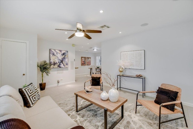 living room with baseboards, ceiling fan, visible vents, and recessed lighting