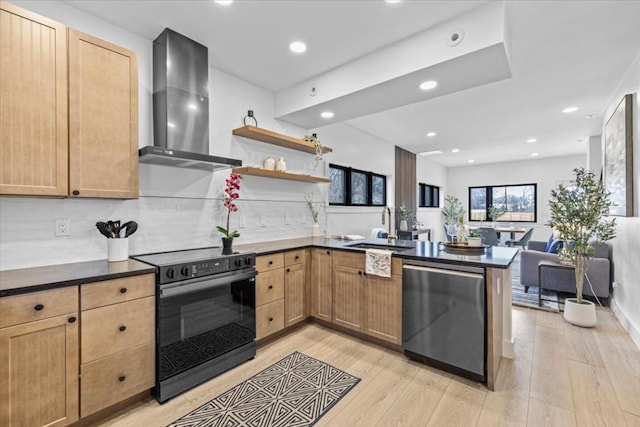 4709 Depew Ave Unit B, Austin, TX 78751 - kitchen featuring black range with electric stovetop, stainless steel dishwasher, wall chimney exhaust hood, a peninsula, and light wood finished floors