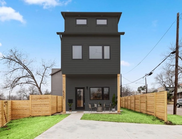 4709 Depew Ave Unit B, Austin, TX 78751 - back of property with a patio and board and batten siding