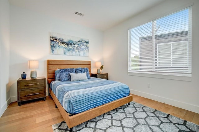 bedroom with hardwood / wood-style floors