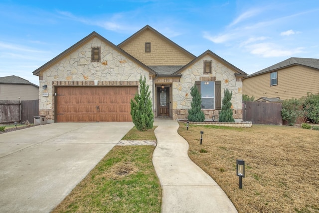 view of front of property with a garage and a front lawn