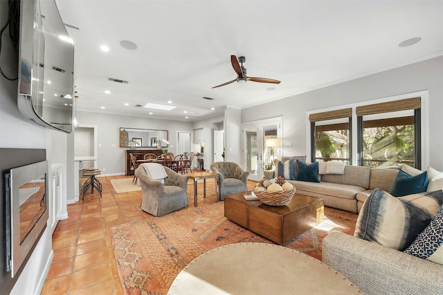 living room featuring crown molding, light tile patterned floors, and ceiling fan