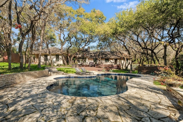 view of pool featuring a patio area