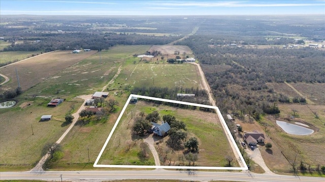 birds eye view of property with a rural view