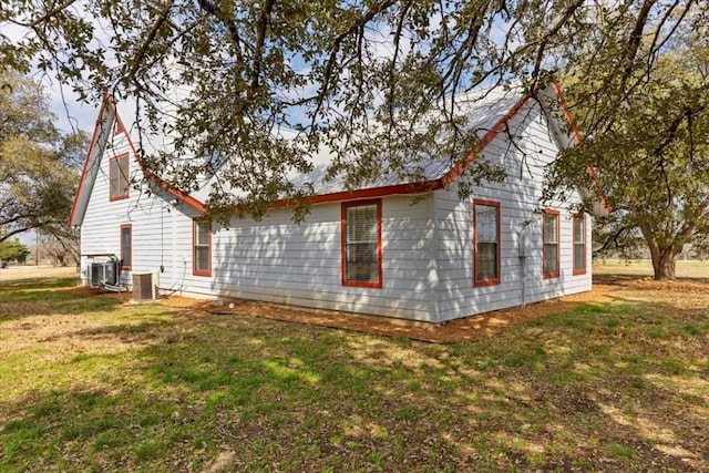 3959 Fm 535, Bastrop, TX 78602 - view of side of home with a yard and a central AC unit