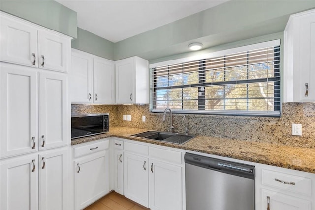 3959 Fm 535, Bastrop, TX 78602 - kitchen with appliances with stainless steel finishes, backsplash, white cabinets, and stone counters