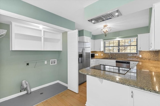 3959 Fm 535, Bastrop, TX 78602 - kitchen with decorative backsplash, white cabinets, and appliances with stainless steel finishes