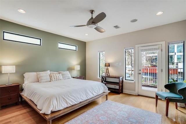 bedroom featuring ceiling fan, light wood-type flooring, and access to outside