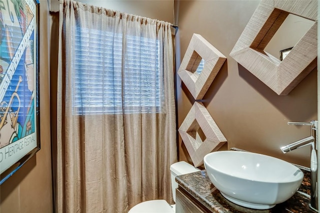 bathroom with vanity and toilet