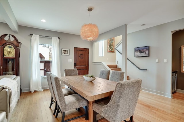 1109 Holly St Unit B, Austin, TX 78702 - dining room with light wood-style floors, stairs, recessed lighting, and baseboards