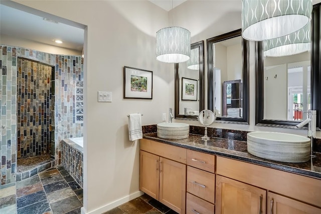 1109 Holly St Unit B, Austin, TX 78702 - full bathroom featuring stone tile flooring, walk in shower, baseboards, double vanity, and recessed lighting