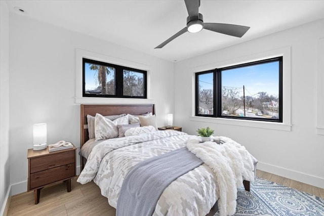 bedroom featuring light hardwood / wood-style floors and ceiling fan