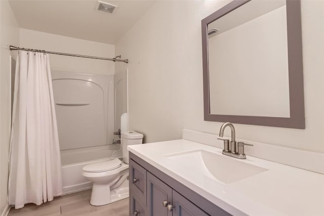 bathroom featuring visible vents, toilet, shower / tub combo, vanity, and wood finished floors