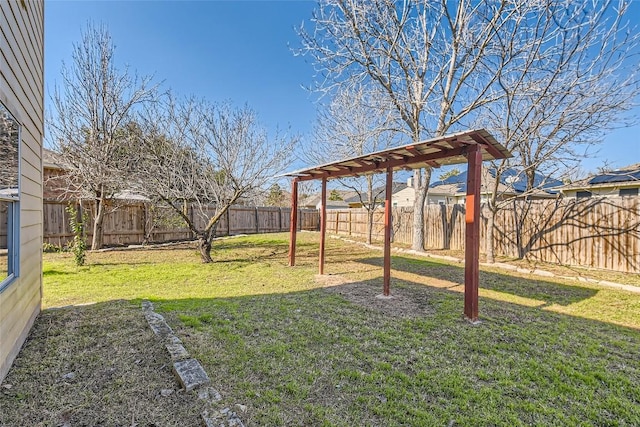 view of yard with a fenced backyard