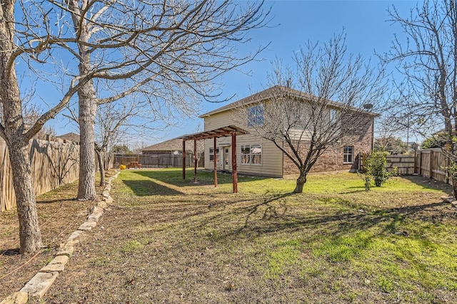 view of property exterior with a yard, brick siding, and a fenced backyard