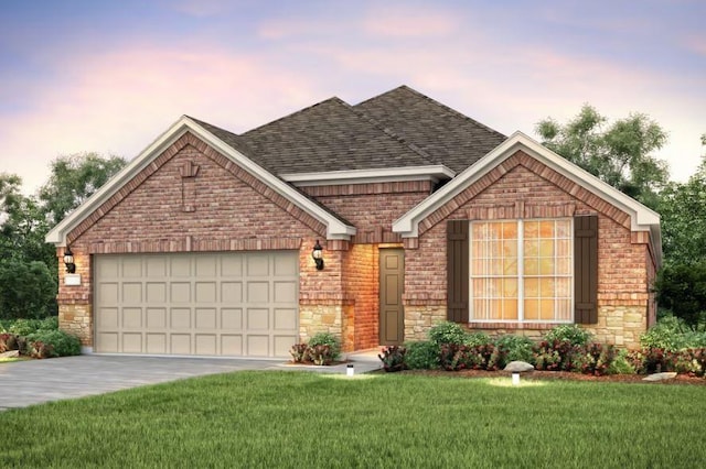 view of front facade featuring a garage and a lawn