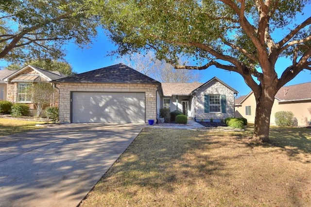 104 Grapevine Ln, Georgetown, TX 78633 - single story home with stone siding, a garage, driveway, and a front lawn