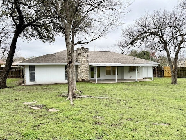 12104 Sage Hen Cir, Austin, TX 78727 - rear view of house featuring a patio, a chimney, and a shingled roof