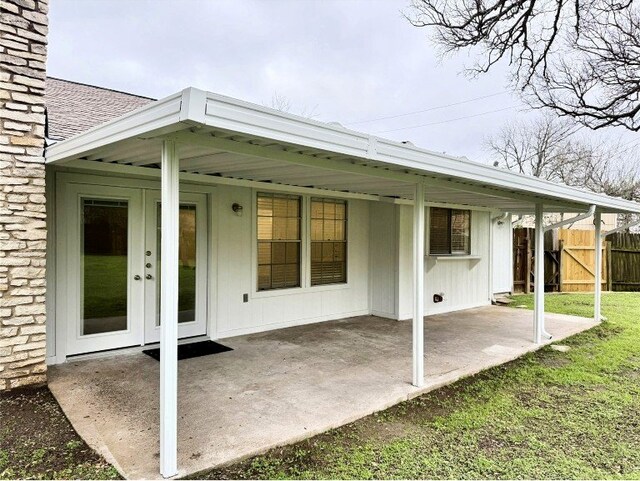 12104 Sage Hen Cir, Austin, TX 78727 - back of property with roof with shingles and a patio