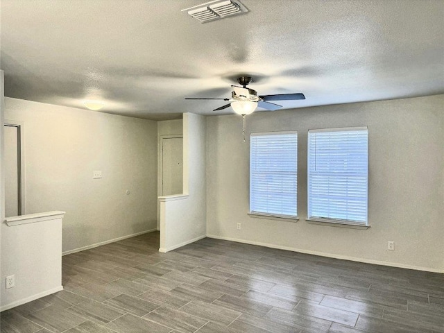 12104 Sage Hen Cir, Austin, TX 78727 - unfurnished room featuring a ceiling fan, a textured ceiling, and wood finished floors