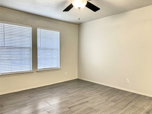 12104 Sage Hen Cir, Austin, TX 78727 - empty room featuring ceiling fan and wood finished floors