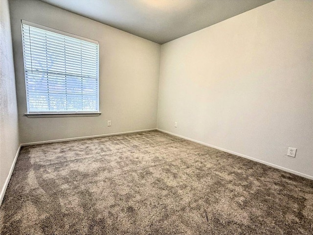 12104 Sage Hen Cir, Austin, TX 78727 - carpeted spare room featuring baseboards