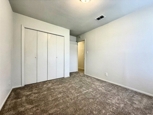 12104 Sage Hen Cir, Austin, TX 78727 - unfurnished bedroom with carpet floors and a closet